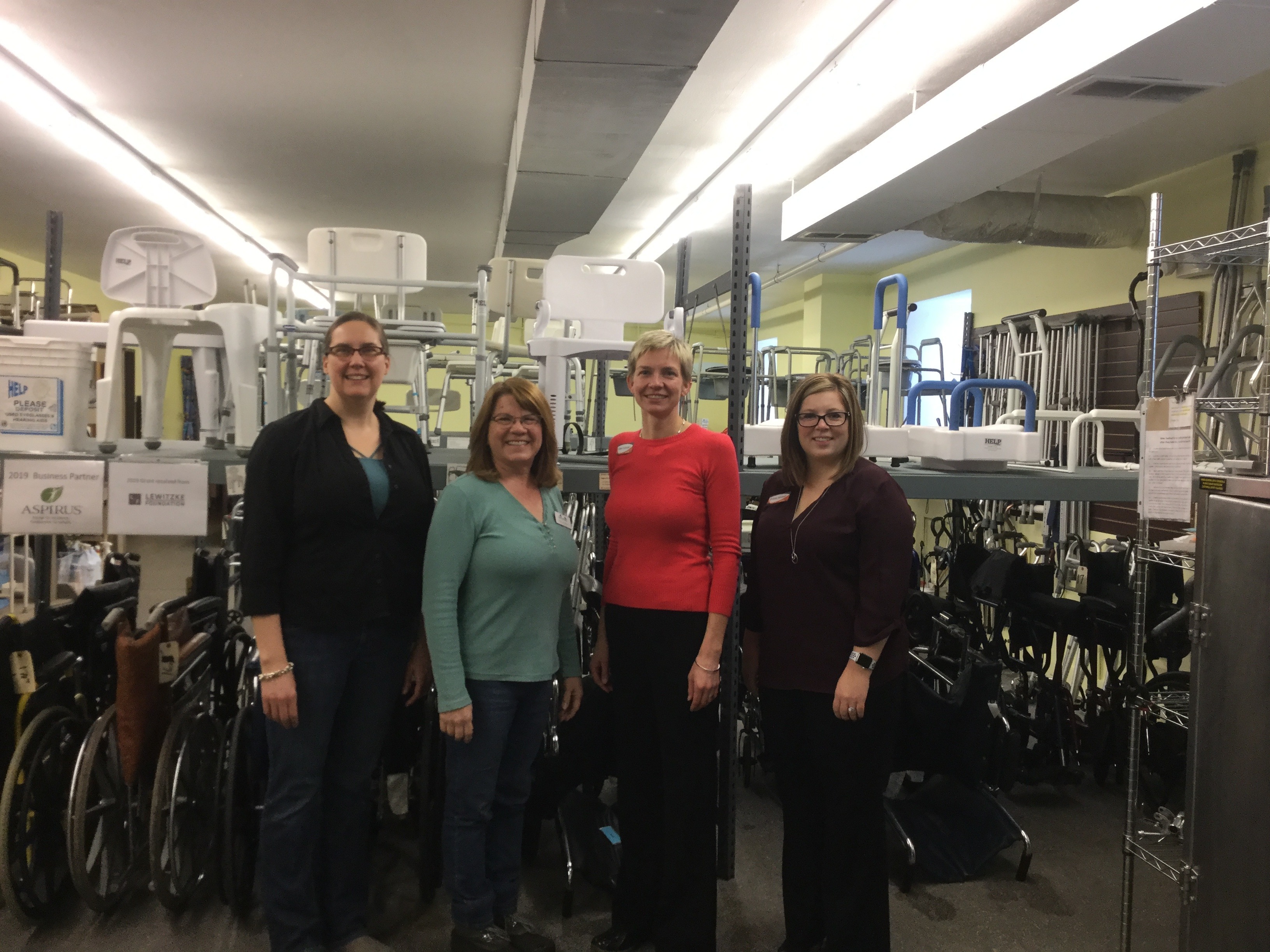 four women on a tour of The Good News Project facility